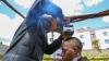 A Kenyan barber who wields a sharpened shovel thrives on Africa's social media craze