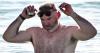 Wayne Rooney pictured topless on Barbados beach as wife Coleen rocks bikini