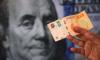 Argentina Sells Dollars to Stem Peso Slide as New FX Rules Take Effect