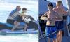Klay Rooney, 12, nurses a bandaged arm while jet-skiing with dad Wayne as the family continue their annual new year beach break in Barbados