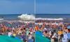 Moment freak 'meteo tsunami' engulfs beach leaving one dead and dozens injured during scramble to escape '30ft wave surge' in Argentina