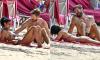Vick Hope shows off her incredible figure in a floral bandeau bikini as she hits the beach in Barbados with shirtless Calvin Harris six months after giving birth to their first child