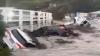 Dramatic moment dozens of cars are swept out to SEA as horror flash floods hit Australia leaving thousands without power