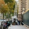 French police officers inspect a furniture elevator used by the thieves