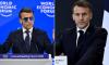 Is there more to Macron's sunglasses than meets the eye? French officials reveal why president has been wearing aviators... as social media runs riot with conspiracy theories
