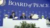 Argentina's President Javier Milei (left) and Armenia's Prime Minister Nikol Pashinyan hold a signed founding charter as US President Donald Trump reacts at the "Board of Peace" meeting during the World Economic Forum (WEF) annual meeting in Davos on…
