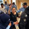 Police take human rights activist Imaan Mazari to a court in Islamabad on August 20, 2023