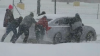 VIDEOS: Baristas, neighbors, and truckers team up to rescue cars in snowy Arkansas