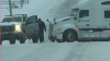 WATCH: Pickup truck rescues 18-wheeler stuck in Arkansas snow