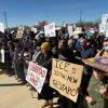 Protesters hold anti-ICE signs outside the South Texas Family Residential Center in Dilley, Texas where hundreds of immigrants are being held, including five-year-old Liam Conejo Ramos and his father, Adrian Conejo Arias, asylum seekers from Ecuador