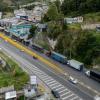 This aerial view shows trucks queueing at the border between Colombia and Ecuador before new tariff measures come into effect in Ipiales, Colombia on January 30, 2026