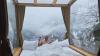 In Georgia’s snowy mountains, a glass‑walled hotel room becomes the view