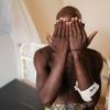 A man infected with mpox showing his hands inside a ward at the Kamenge University Hospital in Bujumbura, Burundi