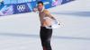 Austrian snowboarder Benjamin Karl rips shirt off after winning gold