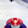 A drone follows Denmark's Nanna Johansen as she takes part in the skeleton women's training session at Cortina Sliding Centre