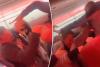 Watch the chaotic moments before ‘racist’ passengers are banned from airline after breaking out into wild brawl in the aisle