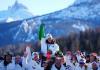 Olympics-Italy sets Winter Games record on medal‑heavy Sunday