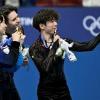 Capturing the moment: Kazakh Mikhail Shaidorov (centre) won Olympic men's figure skating gold