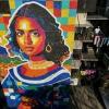 Venezuelan artist Oscar Olivares's latest creation is a mural of a 'Latin American Mona Lisa' on an apartment building in the Zacamil neighborhood in Mejicanos, El Salvador