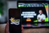 Sports betting giant DraftKings cutting jobs amid fight with prediction markets