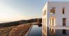 monolithic white ‘avlakia house’ overlooks rugged island of antiparos, greece