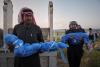 A grieving father buries his 6-year-old after a land mine kills 3 children in Syria’s Idlib