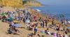 Temperatures hotter than Hawaii as thousands flock to beach