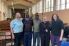 African clergymen meet churchgoers who supported them