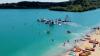 UK lake with bright blue waters and aqua park that ‘feels more like the Med’ has Maldives-like overwater bungalows