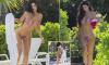Kylie Jenner sizzles in a tiny bikini as she continues her Turks and Caicos getaway... a year after admitting she got breast implants