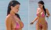 Kylie Jenner makes eye-popping display in pink bikini as she romps in the water with pals in Turks and Caicos