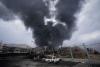 Iran fires missiles, drones at Bahrain and Kuwait; US strikes Tehran radar sites