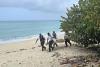 Police officers help clean up West Bay