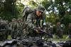 100 Colombian guerrillas disarm in deal with leftist government