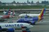 International airfares dip below $1K but remain elevated