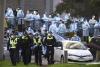 Australia deals with virus spike; Serbia erupts in violence