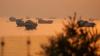 Iran fires on commercial ships traveling through Strait of Hormuz, US official says - report