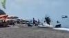 Wild moment idiot paraglider wipes out beachgoers after losing control during botched takeoff on packed beach