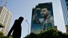 A woman walks near a mural depicting football star Lionel Messi in Buenos Aires on June 23, 2026, during the FIFA World Cup 2026.