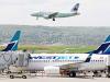 Canadians may pay hundreds more for summer vacation flights, despite falling oil prices