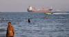 British military says ship was hit by projectile on UN-approved route through the Strait of Hormuz