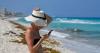 Work emails, doomscrolling: why 80% of Aussies just can't let go on holidays