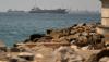Iran launches drone assault on Bahrain and a ship is hit in Strait of Hormuz as ceasefire frays