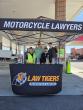 Law Tigers give free gas to motorcycle riders in Bedford Park 