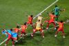 Congo rallies to a 3-1 win against Uzbekistan to seal place in World Cup knockouts