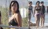 Cristiano Ronaldo's fiancée Georgina Rodriguez shows off her bombshell curves in a black bikini as she hits the beach with friends in Miami during the World Cup