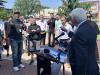 On a sidewalk, John Larson denounces ICE and gets a challenge from radio host