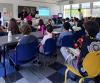 Queens high-schoolers teach financial literacy to middle school students in Astoria