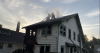 2 rescued from roof of burning home Tuesday in Kansas City, Missouri