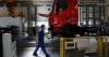 China’s factory output in June beats forecasts